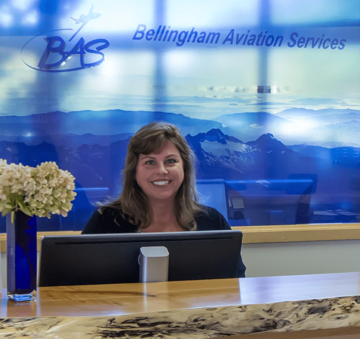 Smiling receptionist at Bellingham Aviation Services